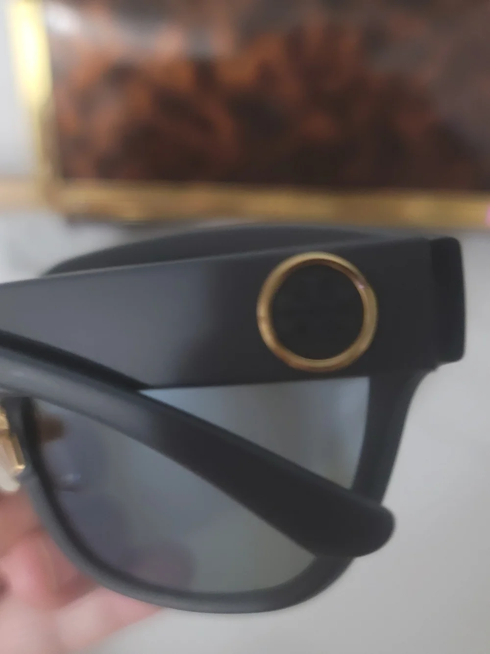 Tory Burch Black Frame Sunglasses with Blue Mirrored Lenses